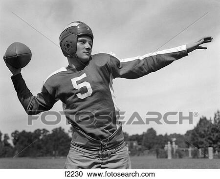 1940S Young Teen Quarterback About To Toss Football Pass View Large Photo Image Stock Image - 1940S Young Teen Quarterback About To Toss Football Pass . Fotosearch
