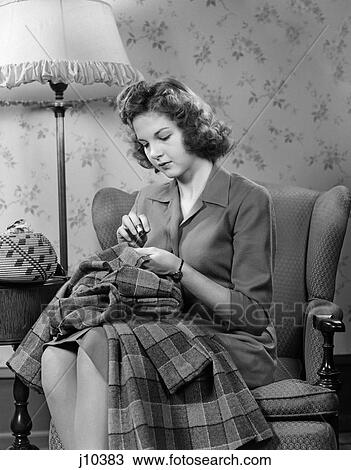 1940S Young Woman Teen Sitting In Chair Under Lamp Sewing View Large Photo Image Stock Image - 1940S Young Woman Teen Sitting In Chair Under Lamp Sewing . Fotosearch