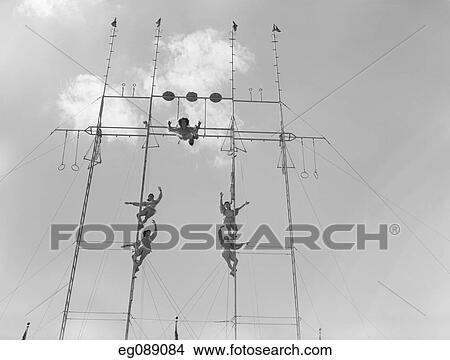 1950S Six Circus Performers On High Trapeze View Large Photo Image Picture - 1950S Six Circus Performers On High Trapeze. Fotosearch
