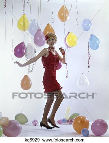 1980S Woman In Red Fringe Dress Dancing Charleston Dance Party Balloons On Floor & Hanging 1920S Music View Large Photo Image Stock Photo - 1980S Woman In Red Fringe Dress Dancing Charleston Dance Party Balloons On Floor & Hanging 1920S Music. Fotosearch