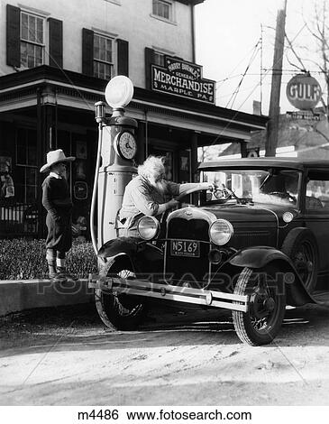 Elderly Grandfather Filling Up Ford Car In Front Of Pennsylvania General Store With Grandson Watching 1930S View Large Photo Image Stock Photograph - Elderly Grandfather Filling Up Ford Car In Front Of Pennsylvania General Store With Grandson Watching 1930S . Fotosearch