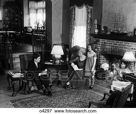 Family 3 Mother Father Child Girl Man Woman Living Room Fireplace Rug Lounge Relax Talk Affluent 1920S Upscale Retro Vintage View Large Photo Image Stock Photo - Family 3 Mother Father Child Girl Man Woman Living Room Fireplace Rug Lounge Relax Talk Affluent 1920S Upscale Retro Vintage. Fotosearch