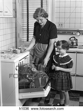 Stock Photograph - Woman Child Daughter Kitchen Dishwasher Cleaning 1940S Retro. Fotosearch