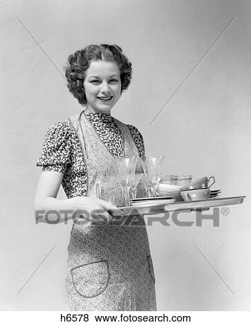 Woman Dishes Tray Platter Smiling Apron Retr0 1940S View Large Photo Image Stock Photo - Woman Dishes Tray Platter Smiling Apron Retr0 1940S. Fotosearch