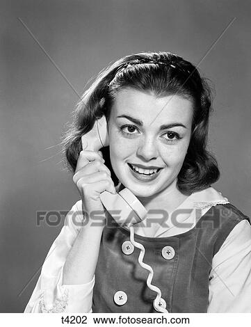 1950 1950S 1960 1960S Young Woman Talking On Telephone View Large Photo Image Stock Image - 1950 1950S 1960 1960S Young Woman Talking On Telephone . Fotosearch