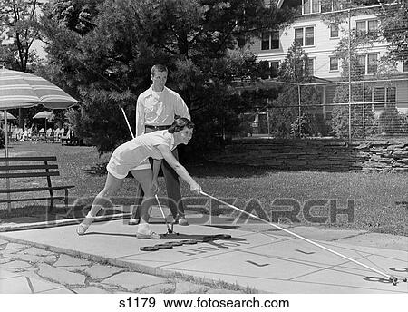 1950 1950S Boy And Girl Playing Deck Shuffleboard View Large Photo Image Stock Photo - 1950 1950S Boy And Girl Playing Deck Shuffleboard . Fotosearch
