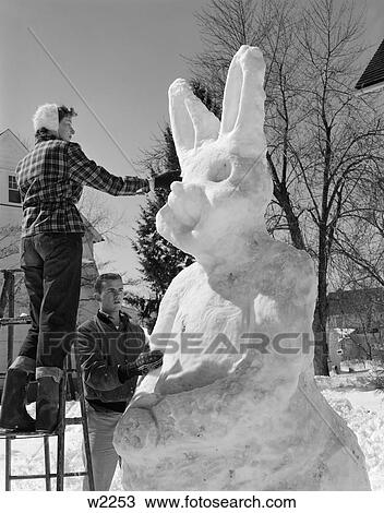 1950 1950S Couple Outside Sculpting Giant Snow Bunny View Large Photo Image Stock Image - 1950 1950S Couple Outside Sculpting Giant Snow Bunny . Fotosearch