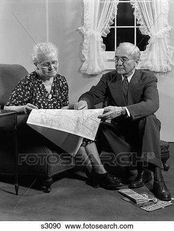1950 1950S Elderly Couple Looking At Map View Large Photo Image Stock Image - 1950 1950S Elderly Couple Looking At Map . Fotosearch