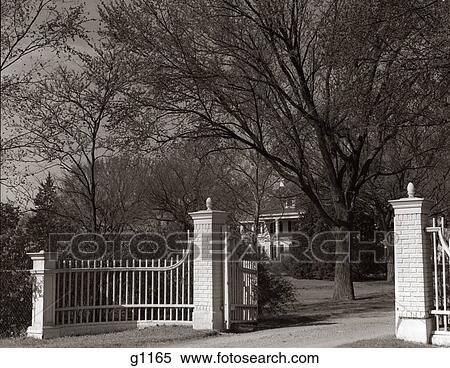 1950 1950S Gate Gated Entrance To Estate Manor House Entry Mansion Estates Gates Gateway Fence Gateways Fences Retro View Large Photo Image Stock Photography - 1950 1950S Gate Gated Entrance To Estate Manor House Entry Mansion Estates Gates Gateway Fence Gateways Fences Retro . Fotosearch