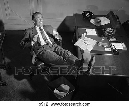 1950 1950S Man Accomplishment Desk Feet Up Suit Business View Large Photo Image Stock Image - 1950 1950S Man Accomplishment Desk Feet Up Suit Business . Fotosearch