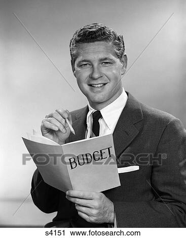 1950 1950S Man In Business Suit Holding Pencil And Budget Book View Large Photo Image Stock Image - 1950 1950S Man In Business Suit Holding Pencil And Budget Book . Fotosearch