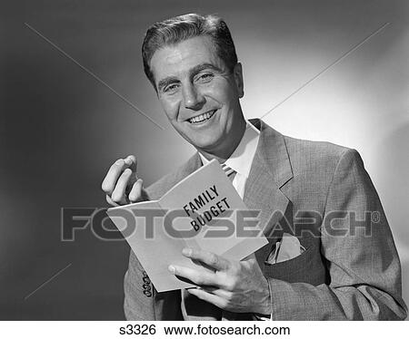 1950 1950S Man In Suit Holding Family Budget Booklet View Large Photo Image Stock Photograph - 1950 1950S Man In Suit Holding Family Budget Booklet . Fotosearch