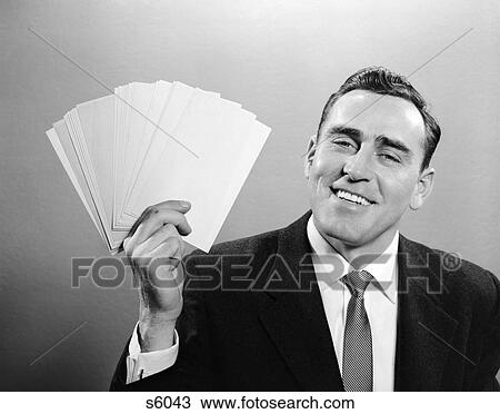 1950 1950S Man In Suit Holding Up Index Cards View Large Photo Image Stock Image - 1950 1950S Man In Suit Holding Up Index Cards . Fotosearch