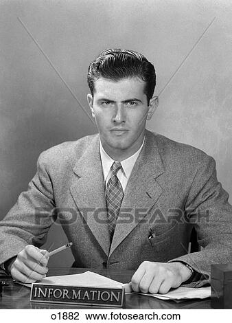 1950 1950S Man Sitting At Information Desk In Office View Large Photo Image Stock Image - 1950 1950S Man Sitting At Information Desk In Office . Fotosearch