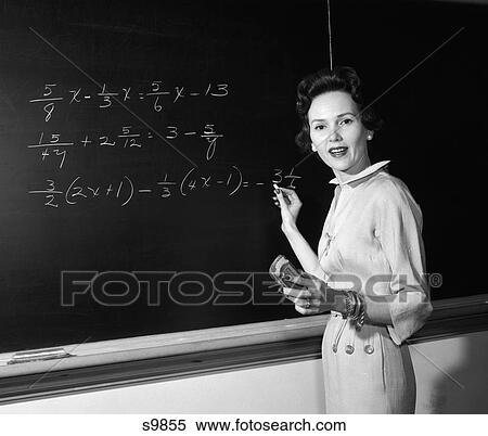 1950 1950S Math Teacher Standing In Front Of Board Holding Chalk And Eraser View Large Photo Image Stock Photography - 1950 1950S Math Teacher Standing In Front Of Board Holding Chalk And Eraser . Fotosearch