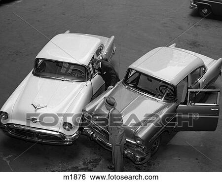 1950 1950S Retro Car Accident Men Hat Parking Lot View Large Photo Image Stock Photograph - 1950 1950S Retro Car Accident Men Hat Parking Lot . Fotosearch