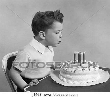 1950 1950S Retro Child Blowing Out Birthday Candles View Large Photo Image Stock Photo - 1950 1950S Retro Child Blowing Out Birthday Candles . Fotosearch