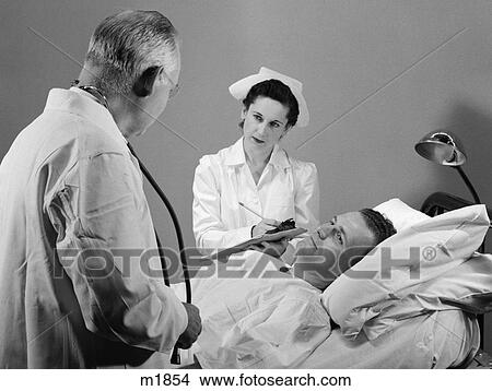 1950 1950S Retro Doctor Nurse Patient Bed Hospital Sick Illness View Large Photo Image Picture - 1950 1950S Retro Doctor Nurse Patient Bed Hospital Sick Illness . Fotosearch
