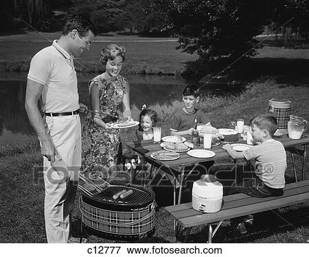 Stock Photo - 1950 1950S Retro Family Picnic Bbq Mom Dad Children . Fotosearch