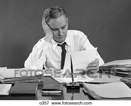 1950 1950S Retro Man Business Paperwork Tired Overowrked  View Large Photo Image Stock Photo - 1950 1950S Retro Man Business Paperwork Tired Overowrked . Fotosearch