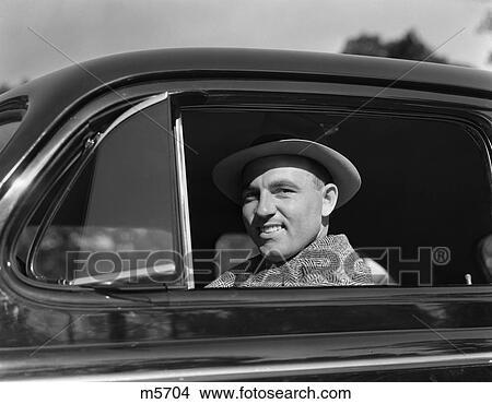 Picture - 1950 1950S Retro Man Car Smile Smirk . Fotosearch