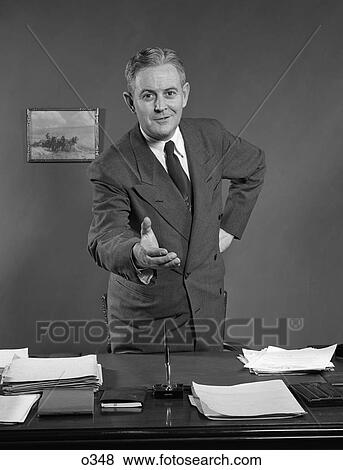 1950 1950S Retro Man Handshake Deal Desk Suit View Large Photo Image Stock Photo - 1950 1950S Retro Man Handshake Deal Desk Suit . Fotosearch