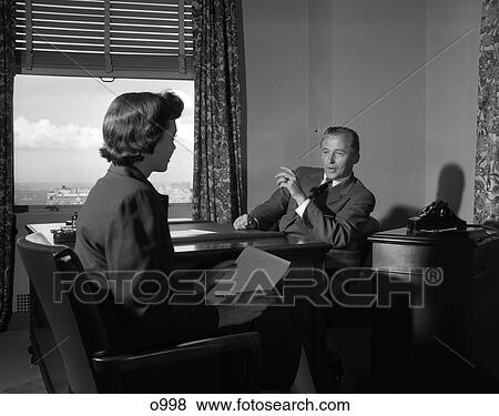 1950 1950S Retro Man Woman Secretary Boss Telephone Desk Paperwork View Large Photo Image Stock Photo - 1950 1950S Retro Man Woman Secretary Boss Telephone Desk Paperwork . Fotosearch