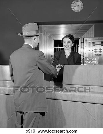 1950 1950S Retro Man Woman Teller Bank Finance Hat Suit Service Smile Money View Large Photo Image Stock Photo - 1950 1950S Retro Man Woman Teller Bank Finance Hat Suit Service Smile Money . Fotosearch