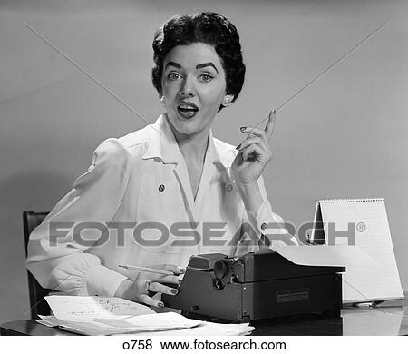 1950 1950S Retro Woman Desk Secretary Typewriter Finger Idea Talk View Large Photo Image Stock Photo - 1950 1950S Retro Woman Desk Secretary Typewriter Finger Idea Talk . Fotosearch