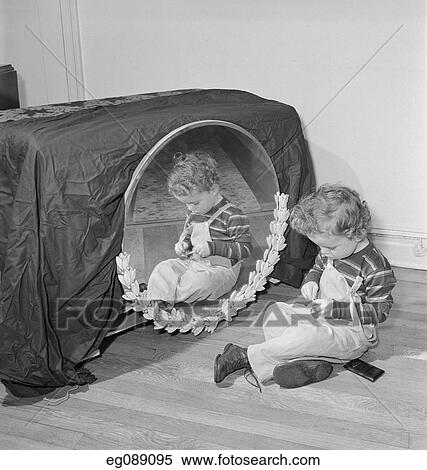 1950 1950S Small Boy Sitting On Floor Before Mirror Playing With Trinket View Large Photo Image Stock Photography - 1950 1950S Small Boy Sitting On Floor Before Mirror Playing With Trinket. Fotosearch
