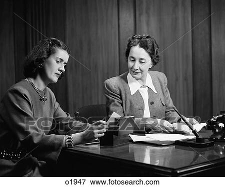 1950 1950S Two Womensitting At Desk In Office View Large Photo Image Stock Photo - 1950 1950S Two Womensitting At Desk In Office . Fotosearch