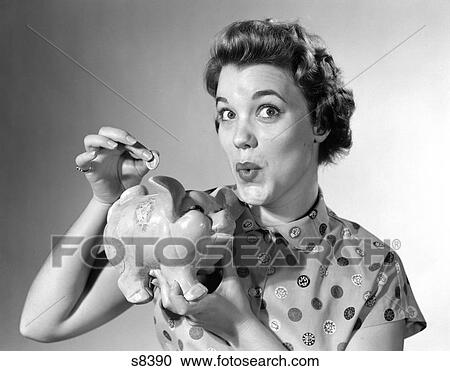 1950 1950S Woman Dropping Money In Piggy Bank View Large Photo Image Stock Image - 1950 1950S Woman Dropping Money In Piggy Bank . Fotosearch