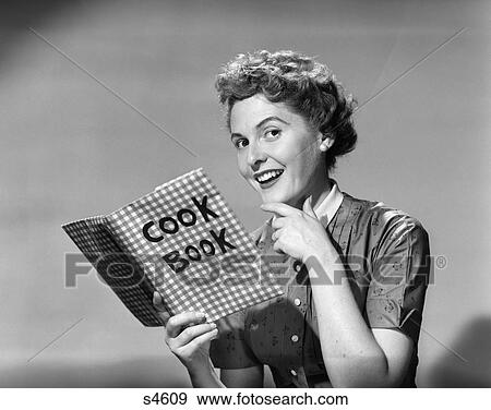 1950 1950S Woman Holding Cookbook Smiling View Large Photo Image Stock Photo - 1950 1950S Woman Holding Cookbook Smiling . Fotosearch