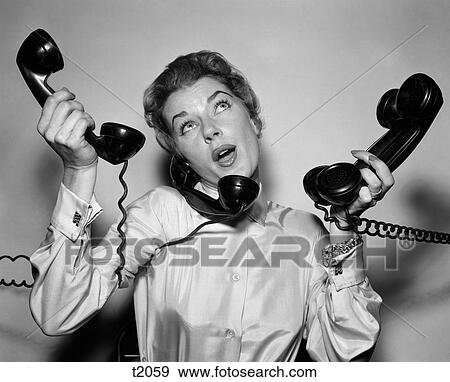 1950 1950S Woman Holding Four Black Telephones Talking On One View Large Photo Image Stock Photo - 1950 1950S Woman Holding Four Black Telephones Talking On One . Fotosearch