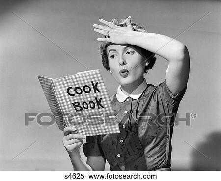 1950 1950S Woman Holding Hand On Forhead Holding Cookbook View Large Photo Image Stock Photography - 1950 1950S Woman Holding Hand On Forhead Holding Cookbook . Fotosearch