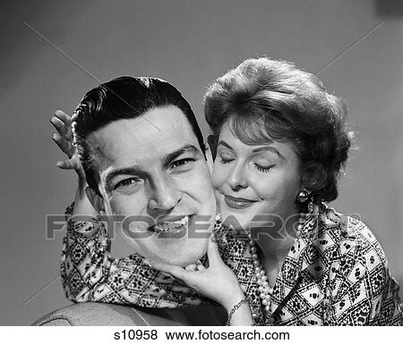 1950 1950S Woman Holding Man'S Picture Cheek To Cheek Eyes Closed Smiling View Large Photo Image Stock Photo - 1950 1950S Woman Holding Man'S Picture Cheek To Cheek Eyes Closed Smiling . Fotosearch