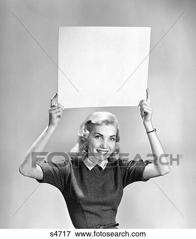 Stock Photo - 1950 1950S Woman Holding Sign . Fotosearch