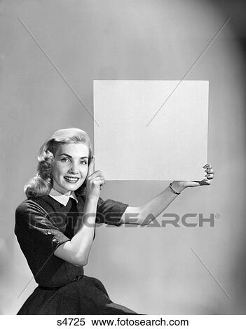 1950 1950S Woman Holding Up Blank Sign View Large Photo Image Stock Photography - 1950 1950S Woman Holding Up Blank Sign . Fotosearch