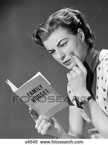 1950 1950S Woman In Apron Finger On Cheek Looking At Family Budget Book View Large Photo Image Stock Photography - 1950 1950S Woman In Apron Finger On Cheek Looking At Family Budget Book . Fotosearch