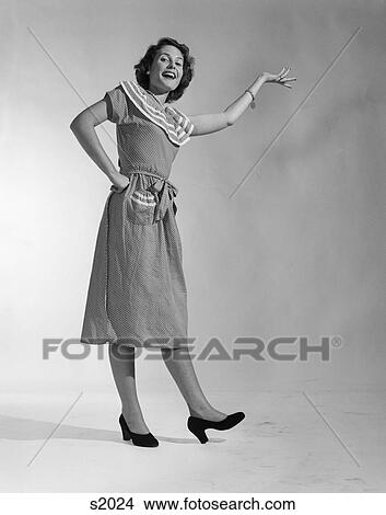 1950 1950S Woman In Polka Dot Dress Arm On Hip With Expression View Large Photo Image Picture - 1950 1950S Woman In Polka Dot Dress Arm On Hip With Expression . Fotosearch