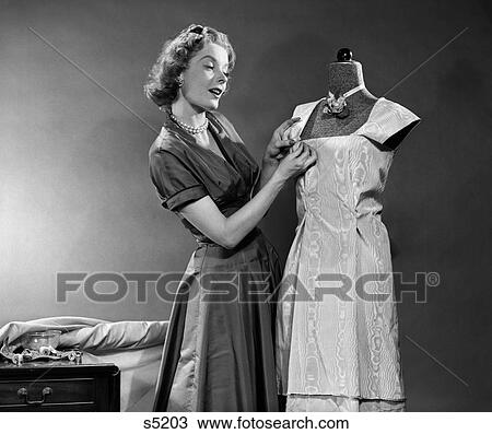 1950 1950S Woman Making Dress Using Mannequin View Large Photo Image Stock Image - 1950 1950S Woman Making Dress Using Mannequin . Fotosearch
