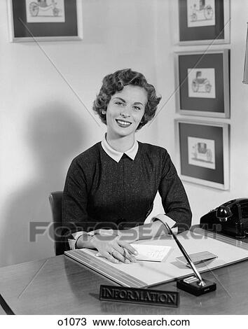 1950 1950S Woman Sitting At Information Desk In Office Holding Pencil And Paper View Large Photo Image Stock Image - 1950 1950S Woman Sitting At Information Desk In Office Holding Pencil And Paper . Fotosearch