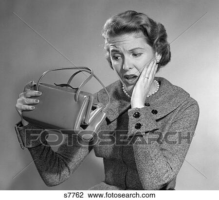 1950 1950S Woman With Exaggerated Expression Hand On Face Looking Inside Her Purse View Large Photo Image Stock Image - 1950 1950S Woman With Exaggerated Expression Hand On Face Looking Inside Her Purse . Fotosearch