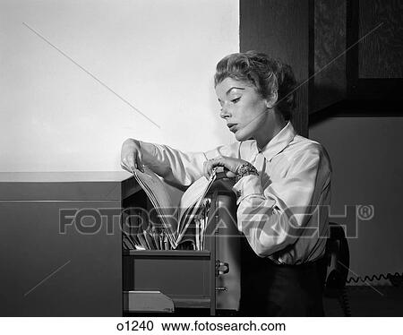 1950 1950S Woman Working In Office Looking Through Files In File Cabinet View Large Photo Image Stock Image - 1950 1950S Woman Working In Office Looking Through Files In File Cabinet . Fotosearch