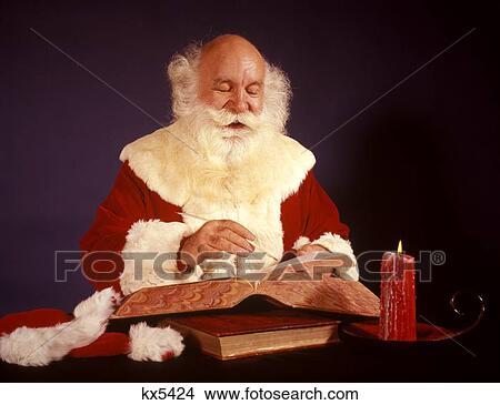 1950S 1960S 1970S Bald Santa Claus Writing List In Big Book By Candle Light Studio Indoor View Large Photo Image Picture - 1950S 1960S 1970S Bald Santa Claus Writing List In Big Book By Candle Light Studio Indoor . Fotosearch