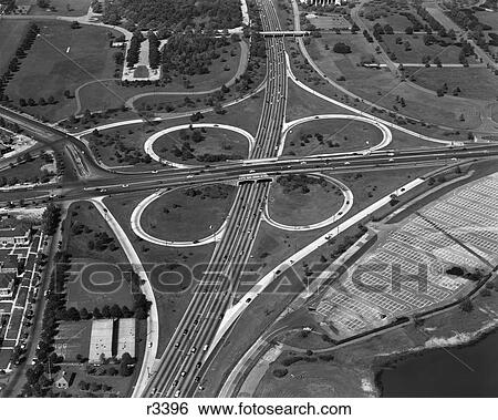Stock Photograph - 1950S 1960S Aerial Cloverleaf Highway Intersection Grand Central Parkway Flushing Meadow Park Queens New York . Fotosearch