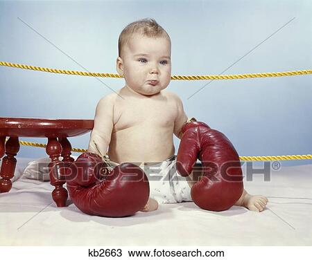 1950'S 1960'S Baby Wearing Diaper And Big Antique Leather Boxing Gloves Unhappy Sitting In Corner Of Ring Retro View Large Photo Image Stock Image - 1950'S 1960'S Baby Wearing Diaper And Big Antique Leather Boxing Gloves Unhappy Sitting In Corner Of Ring Retro . Fotosearch