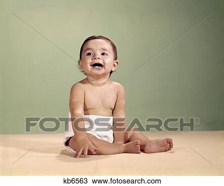 1950'S 1960'S Baby Wearing Diaper Sitting Up Smiling View Large Photo Image Stock Image - 1950'S 1960'S Baby Wearing Diaper Sitting Up Smiling. Fotosearch