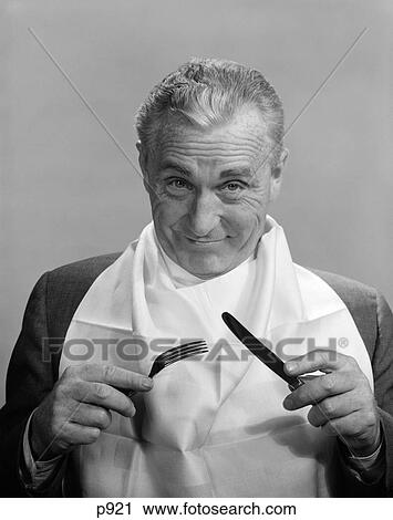 1950S 1960S Elderly Man Wear Napkin As Bib Smiling Holding Knife & Fork Eat Dine Anticipation Food Diet Nutrition View Large Photo Image Stock Image - 1950S 1960S Elderly Man Wear Napkin As Bib Smiling Holding Knife & Fork Eat Dine Anticipation Food Diet Nutrition . Fotosearch
