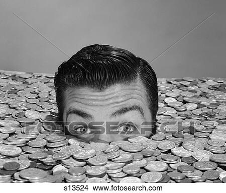 1950S 1960S Funny Man Buried Up To Eyes In Money Coins Drowning In Quarters Currency Finance Rich Win Lottery Wealth Financial View Large Photo Image Picture - 1950S 1960S Funny Man Buried Up To Eyes In Money Coins Drowning In Quarters Currency Finance Rich Win Lottery Wealth Financial. Fotosearch